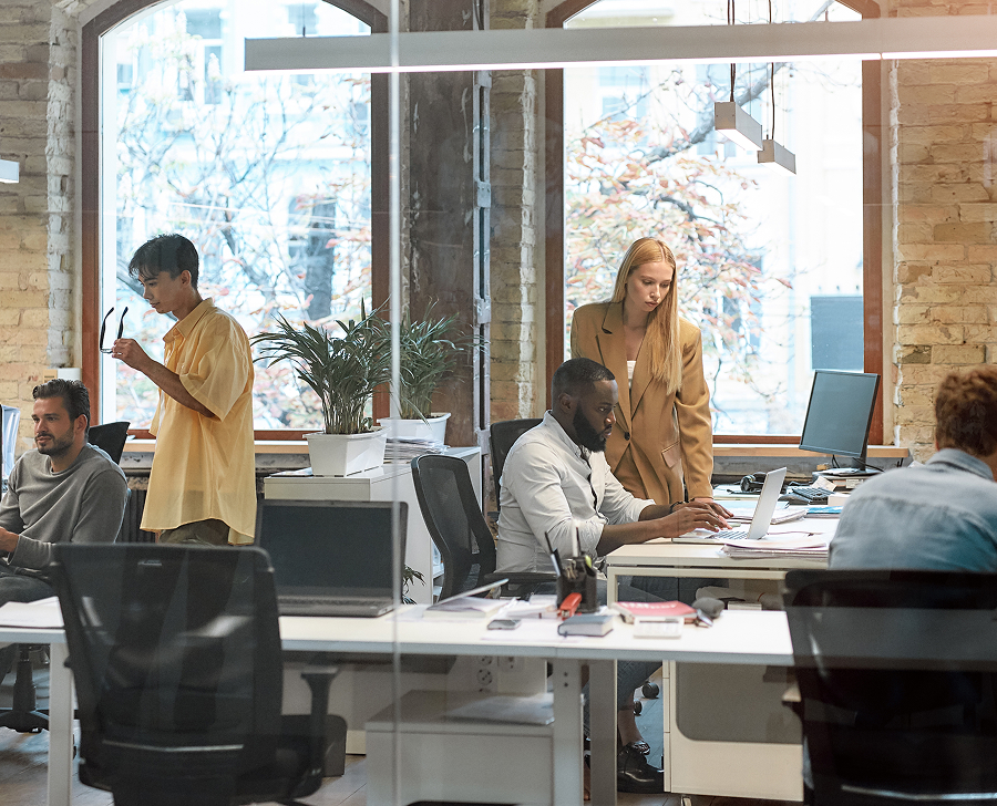 Professionals discussing work in a modern office